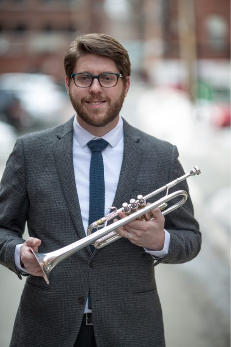Ryan Noe holding a trumpet